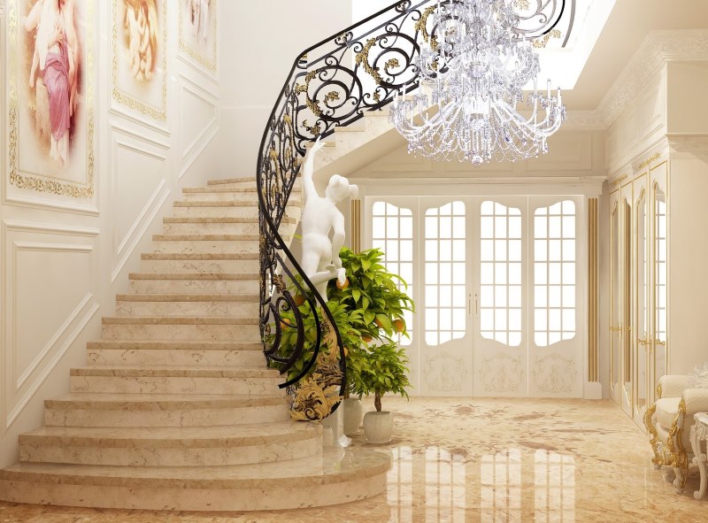 Лестница с кованными перилами в холле частного дома