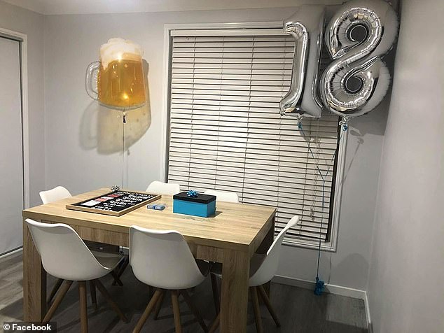 His mother placed the gift in the centre of their dining room table and surrounded it with a pair of 18 balloons and a beer balloon from Big W