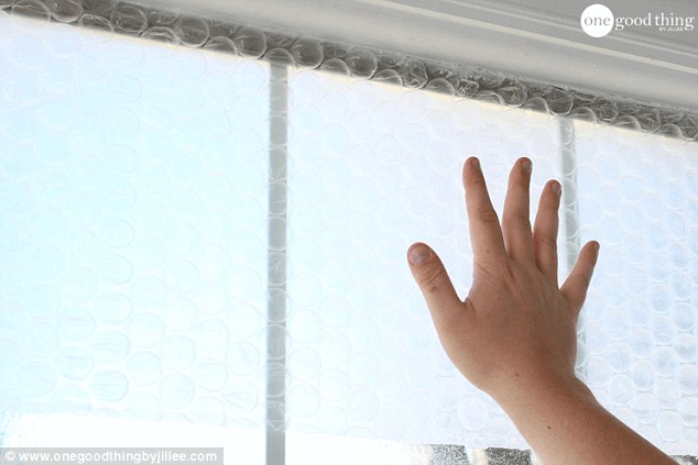 Then press the flat side of the bubble wrap up against the window with your hand 