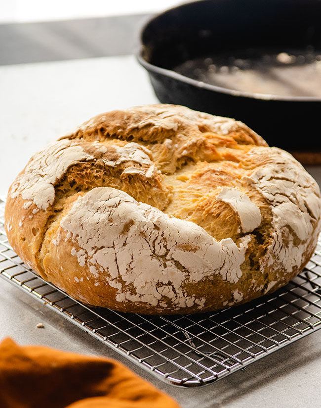 loaf of crusty bread on a small cooling rack