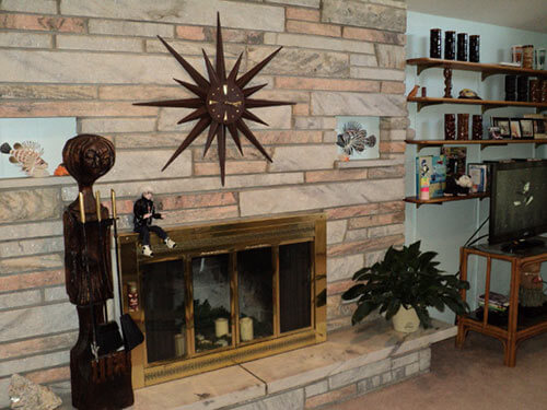 mid century fireplace with starburst clock