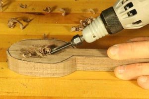 Power carving the bowl on a wooden spoon.