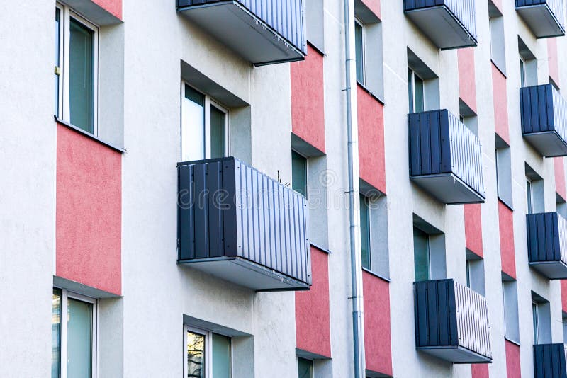 Colorful renovated and thermally insulated apartment house facade stock photography