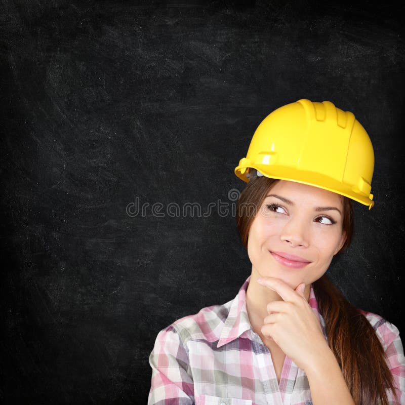 Construction worker woman on chalkboard texture stock photos