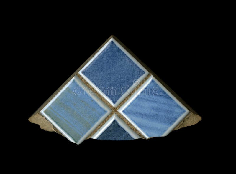 A fragment of the texture. Blue ceramic finishing tiles decorative insulated block on a black background. the isolated fragment. stock photo