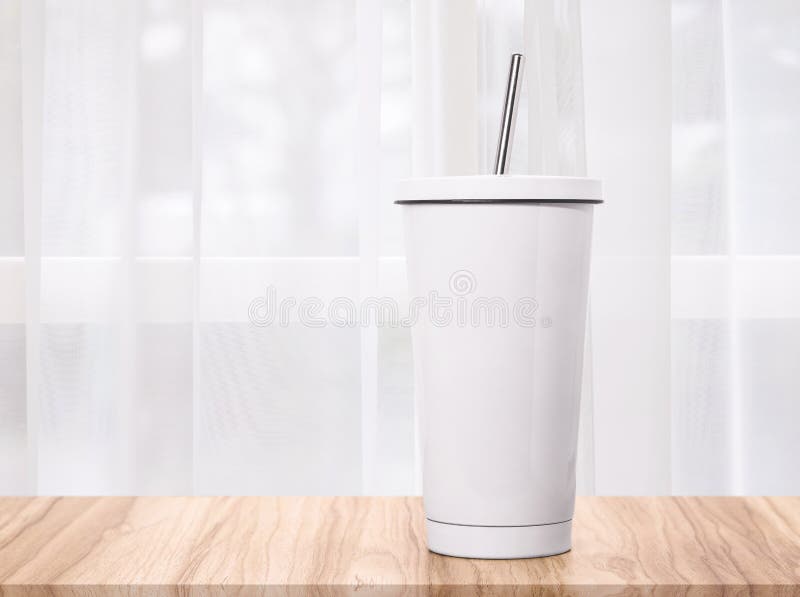 Steel mug on morning backdrops. Insulated drink container. Cup stock photography