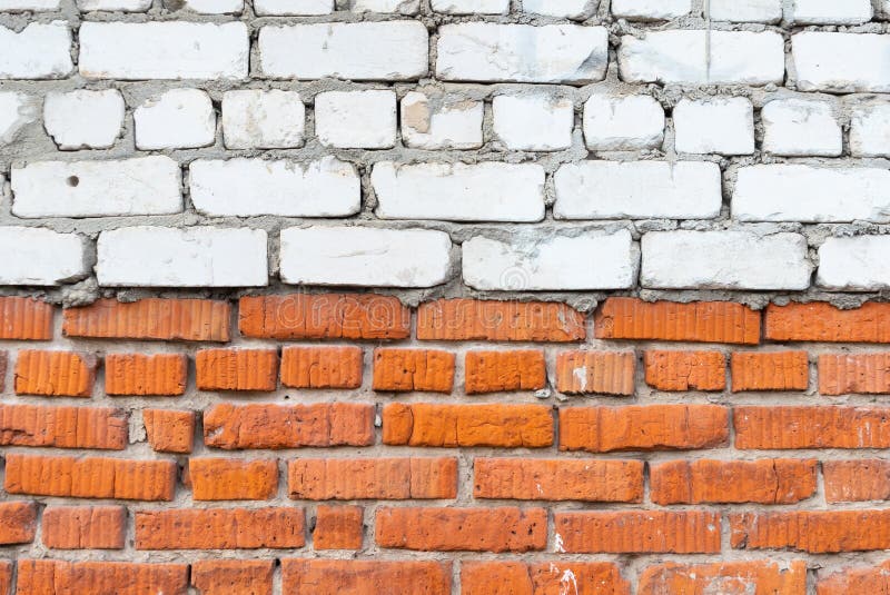 Texture of an old wall of white and red brick with cement mortar. Background of silicate and clay brick in the form of brick. Masonry made of rectangular brick royalty free stock photo