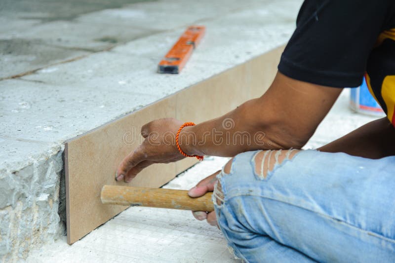 Floor tile installation royalty free stock photo