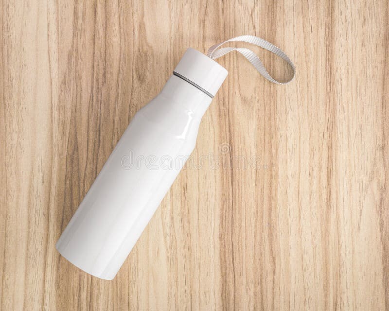 White water bottle on wood background. Insulated container for keep your drink. Canteen stock photography